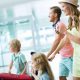 Family arriving at Orlando airport for Universal Studios vacation with luggage and travel essentials